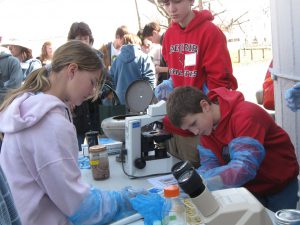 youth at microscopes